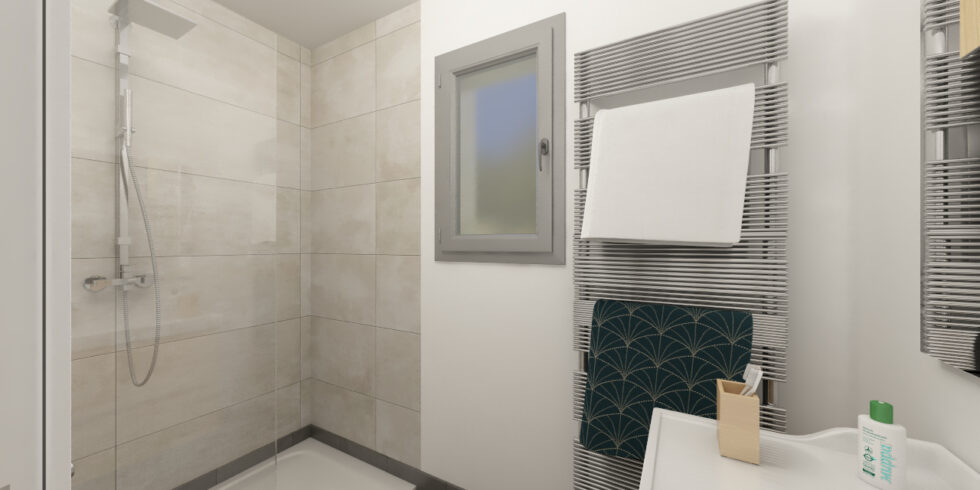 Salle d'eau d'une suite parentale avec douche et sèche-serviettes
